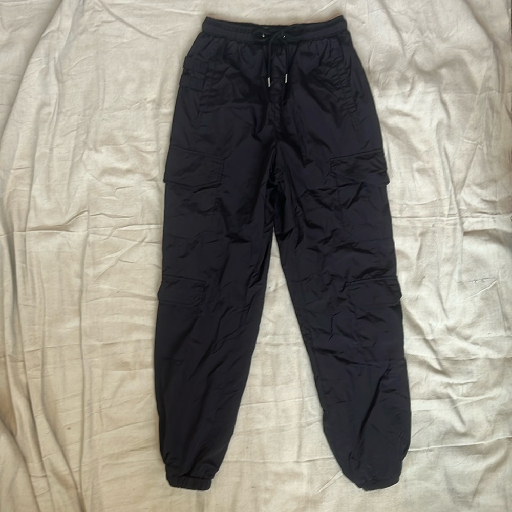 Black track pants with plenty of pockets